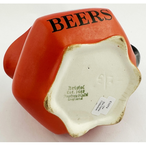 90 - GEORGES BEERS & WYLDS CROWN SCOTCH WATER JUG. 4.1ins tall. Shapely red-orange body, black lettering ... 