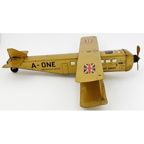 158 - CRAWFORDS AIR SERVICE BI PLANE. 15.6 x 14 x 3.3ins. Large gold coloured bi plane - wings fold in for... 