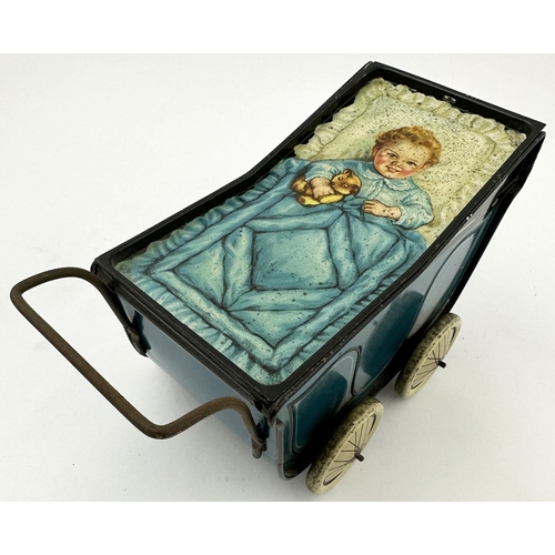 161 - HUNTLEY & PALMERS PERAMBULATOR BISCUITS TIN. 8.2 x 4.8 x 4.2ins. Chuckling blanketed child holding t... 