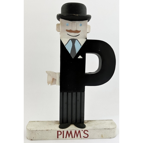 169 - PIMMS BAR TOP ADVERTISING FIGURE. 11ins tall. Very stylish painted wood constructed figure. Most unu... 