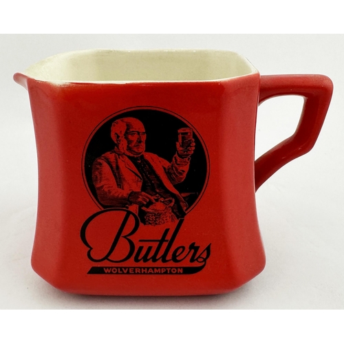 171 - BUTLERS WOLVERHAMPTON PUB JUG. 3.6ins tall. Vivid red body colour with drinking gent, as previous lo... 