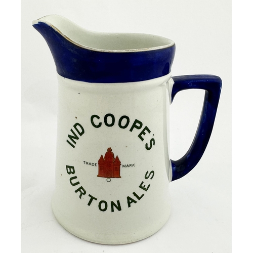 172 - IND COOPES BURTON ALES PUB JUG. 5.6ins tall, protruding lip, rear handle, top deep blue (some wear),... 