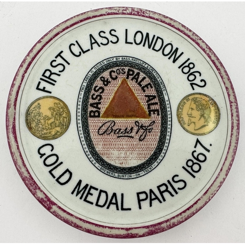 190 - BASS PALE ALE BEER COASTER. 5.7ins diam. Strong blaxk transfer with centre Pale Ale label facsimile,... 