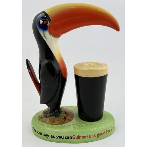 204 - GUINNESS TOUCAN & GLASS BAR TOP FIGURE. 9ins tall. Multi coloured duo on lettered base plinth. Note ... 