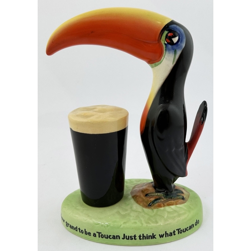 204 - GUINNESS TOUCAN & GLASS BAR TOP FIGURE. 9ins tall. Multi coloured duo on lettered base plinth. Note ... 