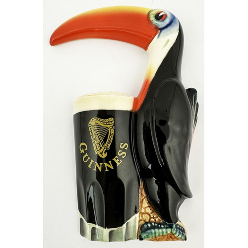 205 - GUINNESS TOUCAN & GLASS WALL PLAQUE. 7 ins tall. Multi coloured toucan set up against a foaming glas... 