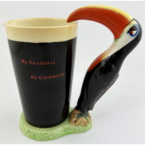 209 - GUINNESS TOUCAN & GLASS BAR TOP FIGURE. 7ins tall. Multi coloured toucan supping from large, lettere... 