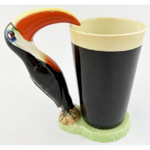 209 - GUINNESS TOUCAN & GLASS BAR TOP FIGURE. 7ins tall. Multi coloured toucan supping from large, lettere... 