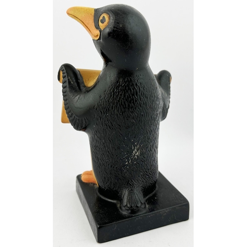 223 - GUINNESS PENGUIN FIGURE. 7ins tall. Naturalistically coloured hollow rubberoid penguin holding plack... 