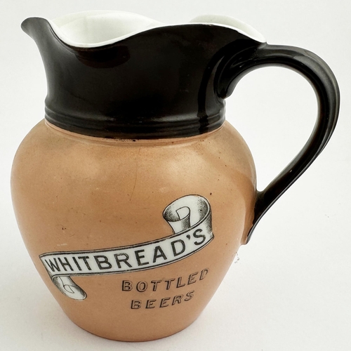 228 - WHITBREADS BOTTLED BEERS PUB JUG. 6.1ins tall. Shapely waisted jug, top dark brown (minor rear glaze... 