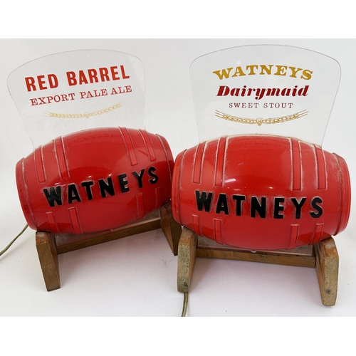 233 - WATNEYS RED BARREL ILLUMINATING BAR TOP DUO. Each approx. 9.3ins tall. Pair red barrels on wooden st... 