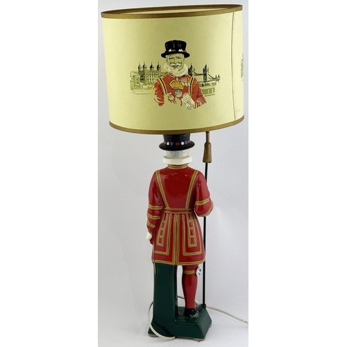 235 - BEEFEATER YEOMAN BAR TOP LAMP. 25.2ins tall. A very impressive multi coloured ceramic Beefeaterholdi... 