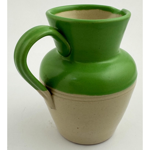 237 - CADENHEAD GREEN LABEL RUM WATER JUG. 5.2ins tall, heavy stoneware. Bright green top, handle, shoulde... 