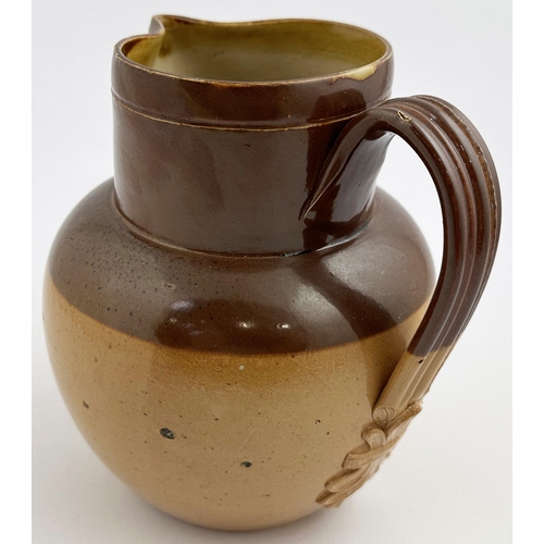 251 - CAMDEN HEAD CAMDEN TOWN WATER JUG. 6.5ins tall. T.t. salt glaze stoneware jug, dark brown top, mid s... 