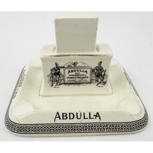 254 - ABDULLA CIGARETTES ASHTRAY & MATCHBOX HOLDER. 4.9 x 3.2ins base, 3.1ins tall. Army clad gents each s... 