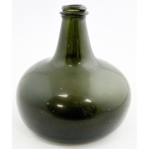 126 - ENGLISH PANCAKE ONION. 7.1ins tall. Black/ very dark green glass, tooled lip (minor decorking flake)... 