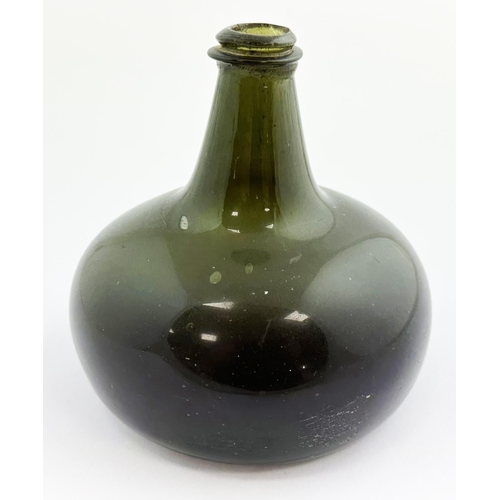 126 - ENGLISH PANCAKE ONION. 7.1ins tall. Black/ very dark green glass, tooled lip (minor decorking flake)... 