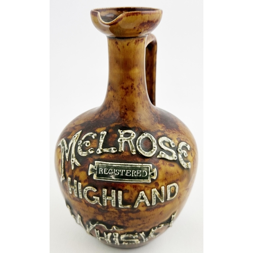 136 - MELROSE HIGHLAND WHISKY JUG. (WG p29). 7.8ins tall. Long neck with flared pouring lip, rear handle. ... 