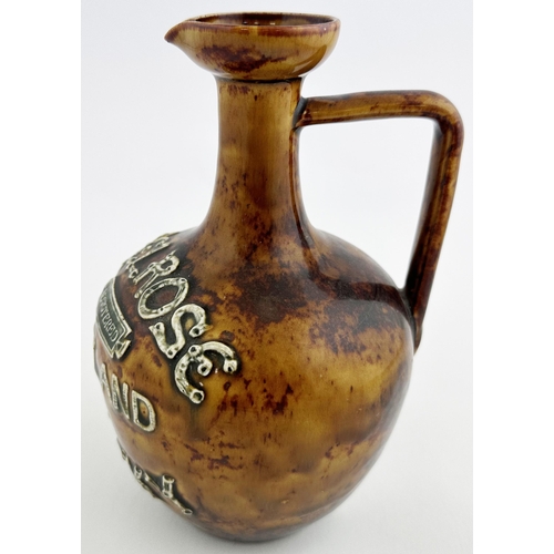 136 - MELROSE HIGHLAND WHISKY JUG. (WG p29). 7.8ins tall. Long neck with flared pouring lip, rear handle. ... 