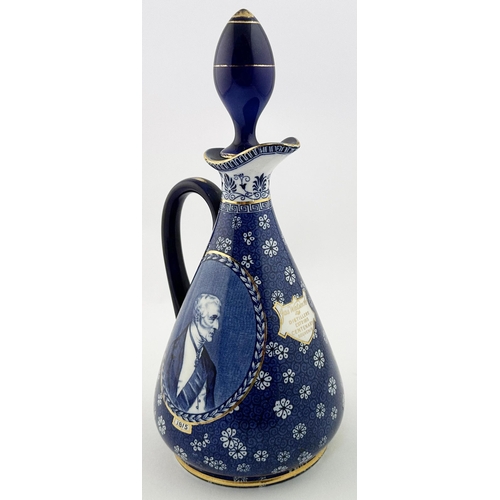 139 - JAS WATSON CENTENARY WHISKY DECANTER. 11.7ins tall. Attractive blue & white ornately decorated pear ... 