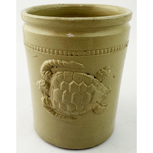 24 - TURTLE SLAB SEAL JAR. 4.9ins tall. Straight sided stoneware cylindrical jar, rim to accommodate tied... 