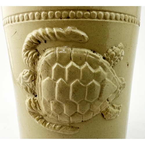 24 - TURTLE SLAB SEAL JAR. 4.9ins tall. Straight sided stoneware cylindrical jar, rim to accommodate tied... 