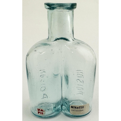 35 - BINOCULARS POISON BOTTLE. (DP p24)3.7ins tall, aqua glass, bluey aqua where thick, square edged lip.... 