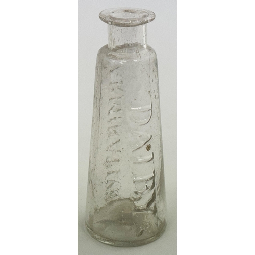 43 - DALBYS CARMINATIVE PONTIL EMBOSSED MEDICINE. 4ins tall. Clear/ lead glass tapering form with a lovel... 