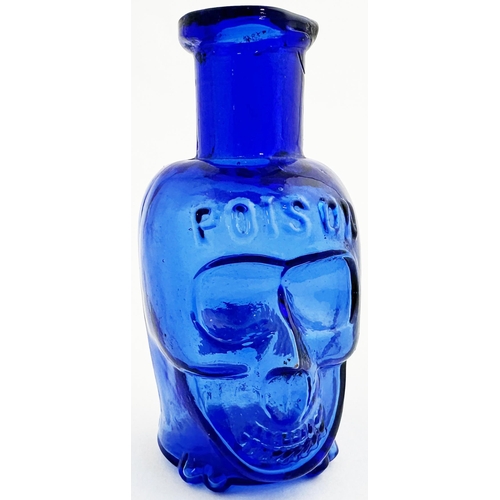 58 - SKULL POISON BOTTLE. (DP pg 20 - correctly dubbed deaths head) 2.8ins tall. Cobalt blue glass moulde... 