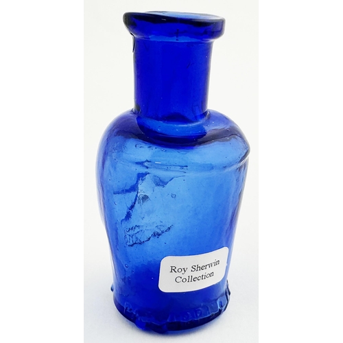 58 - SKULL POISON BOTTLE. (DP pg 20 - correctly dubbed deaths head) 2.8ins tall. Cobalt blue glass moulde... 