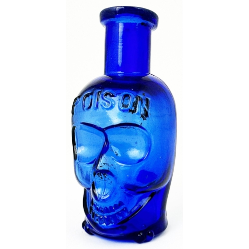 59 - SKULL POISON BOTTLE. (DP pg 20 - correctly dubbed deaths head) 3.6ns tall. Cobalt blue glass moulded... 