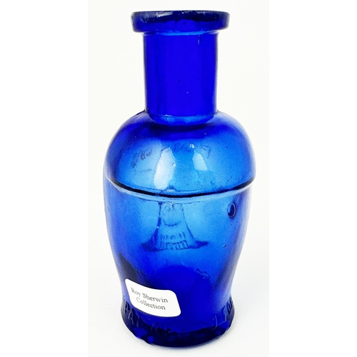 59 - SKULL POISON BOTTLE. (DP pg 20 - correctly dubbed deaths head) 3.6ns tall. Cobalt blue glass moulded... 