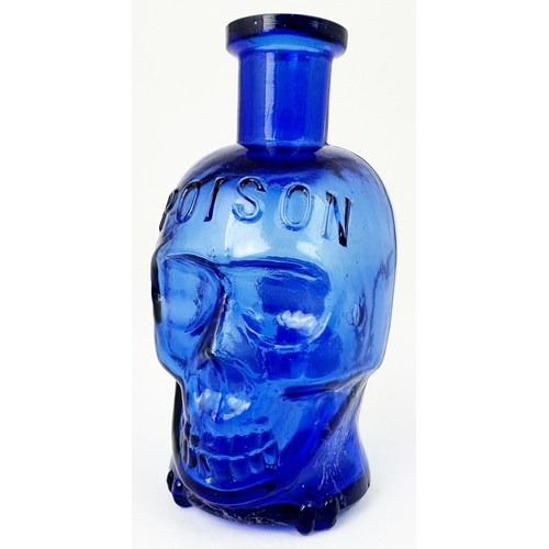 60 - SKULL POISON BOTTLE. (DP pg 20 - correctly dubbed deaths head) 4.1ins tall. Cobalt blue glass moulde... 