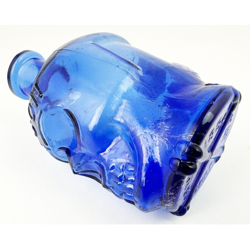 60 - SKULL POISON BOTTLE. (DP pg 20 - correctly dubbed deaths head) 4.1ins tall. Cobalt blue glass moulde... 