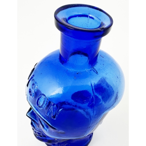 60 - SKULL POISON BOTTLE. (DP pg 20 - correctly dubbed deaths head) 4.1ins tall. Cobalt blue glass moulde... 