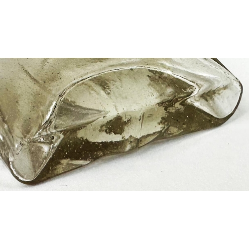 89 - GILBERTSONS WEDGE PATENT POISON BOTTLE. DP p22). Clear lead glass wedge shape. Very heavily & crispl... 