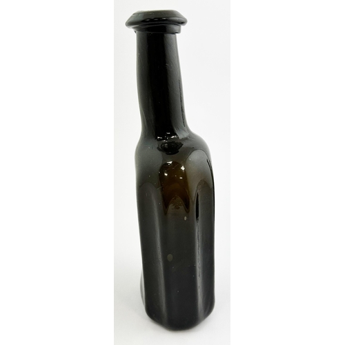 165 - EARLY ENGLISH UTILITY BOTTLE. 8.7ins tall. Extremely dark black glass rectangular form with facetted... 