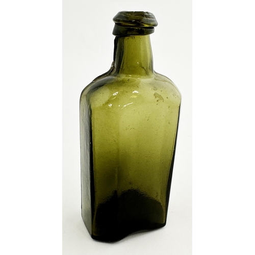 166 - EARLY ENGLISH UTILITY BOTTLE. 5.5ins tall. Dark olive green glass, rectangular body, thinner facette... 