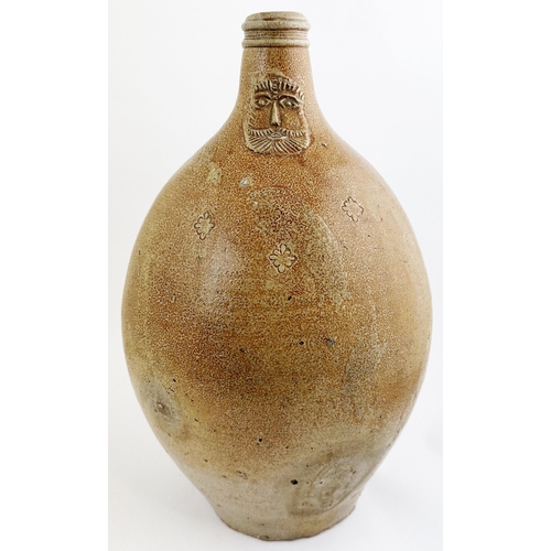 141 - BELLARMINE JUG. 17ins tall. Large size, familiar baluster body shape jug, rear hand applied handle. ... 