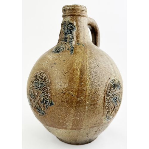 142 - BELLARMINE JUG. 11.6ins tall. Mid size quite bulbous bodied baluster shape, hand applied rear handle... 