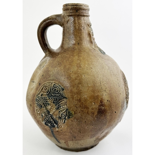 142 - BELLARMINE JUG. 11.6ins tall. Mid size quite bulbous bodied baluster shape, hand applied rear handle... 