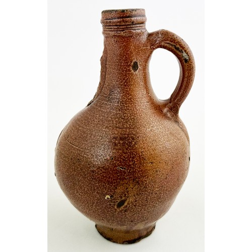 140 - BELLARMINE JUG. 8.2ins tall. Delightful all brown salt glaze classic baluster body, rear handle, sgr... 