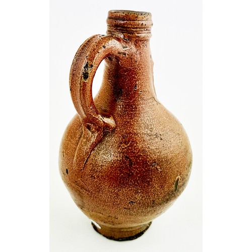 140 - BELLARMINE JUG. 8.2ins tall. Delightful all brown salt glaze classic baluster body, rear handle, sgr... 