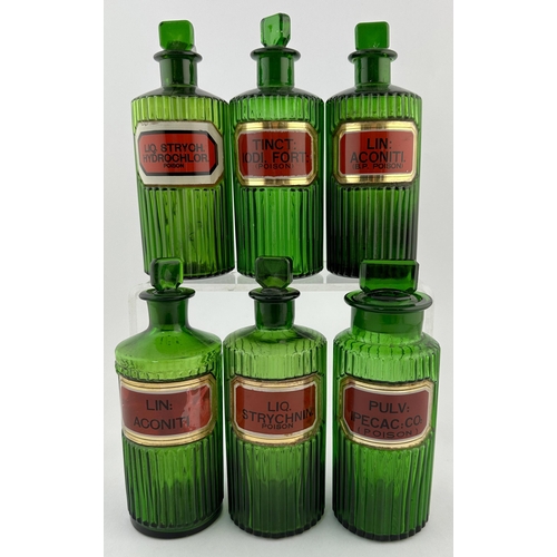 1 - CHEMIST ROUND GROUP. Tallest 6.5ins. Green vertically ribbed, label under glass with stoppers, one b... 