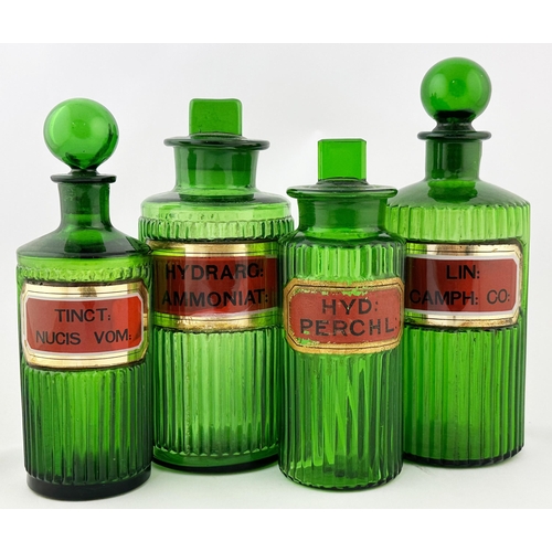 122 - CHEMIST GROUP. Tallest 8.5ins. Ribbed, label under glass, various sizes, all with stoppers. Damages.... 