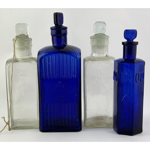 132 - MILITARY CHEMIST BOTTLES GROUP. Tallest 7.5ins. 2 cobalt blue & 2 clear glass with various oz. Minut... 