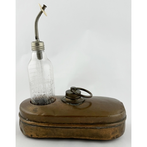 184 - BABY FEEDER WARMER WITH BOTTLE. 11ins tall. Brass holder/ warmer with embossed glass feeding bottle.... 