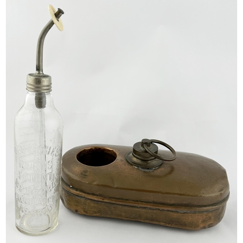 184 - BABY FEEDER WARMER WITH BOTTLE. 11ins tall. Brass holder/ warmer with embossed glass feeding bottle.... 