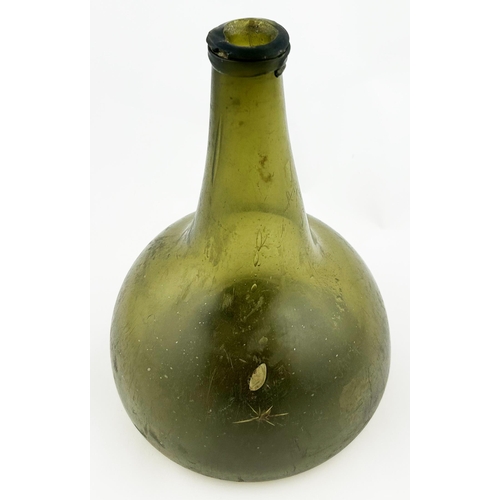 327 - WINE BOTTLE. 8ins tall. Long neck, base pontil. Star crack & lip chips.