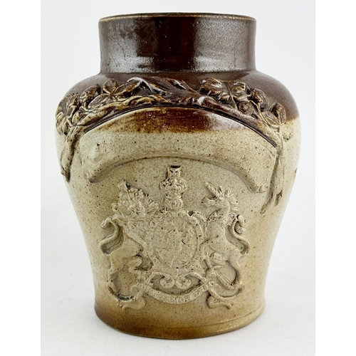 33 - TOBACCO JAR. 6ins tall. Coat of arms to front with plain banner above.